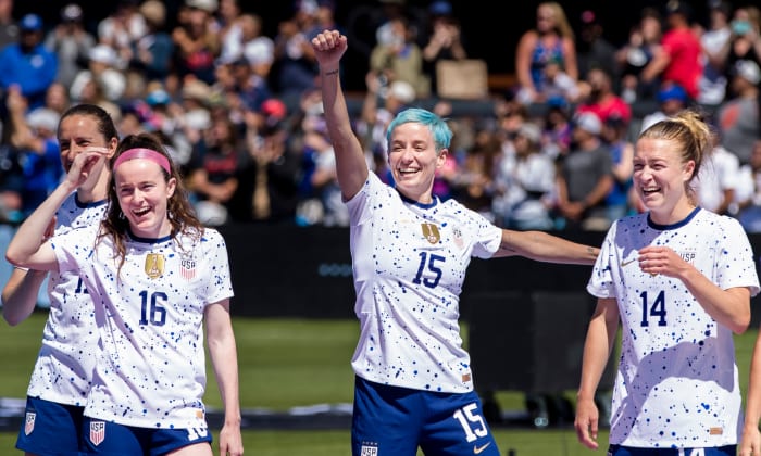 USWNT forward Megan Rapinoe celebrates with her teammates during the send-off celebrations after a game against Wales.